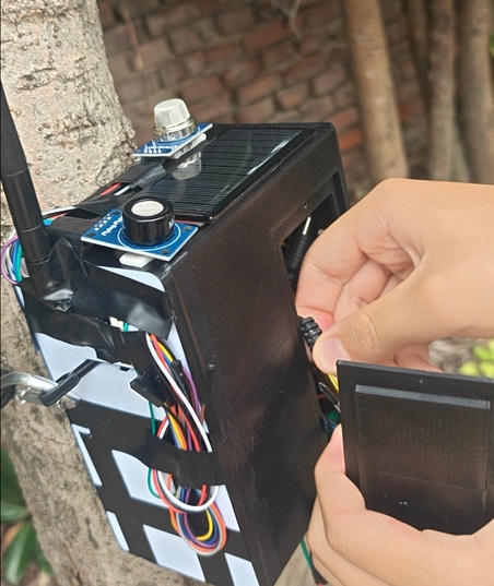 Image: Device being held and tested outdoors